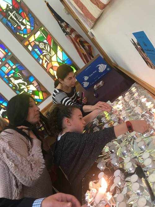 Young families and children at a Shabbat service