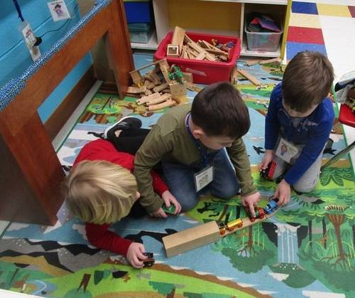 Children playing and learning with trains